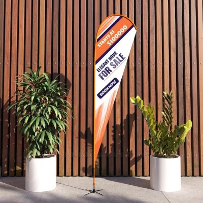 Teardrop Flag Banner Stand Display Mockup in Outdoor Scene with Plant – Free Stock Photo, Download for Free