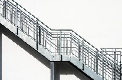 Metal Stairs on a White Building Wall – Free Download