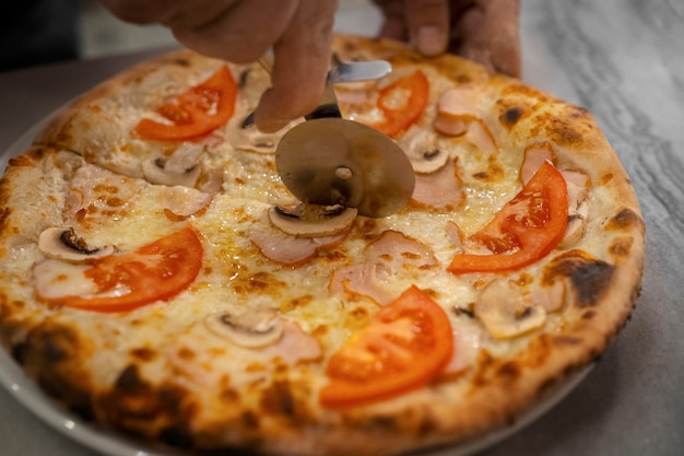 High Angle Chef Cutting Pizza – Download Free Stock Photo