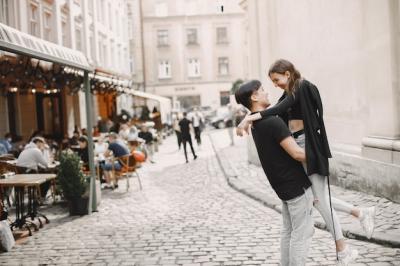 Asian Boy and Caucasian Girlfriend Embrace on a Lviv Street – Free Download