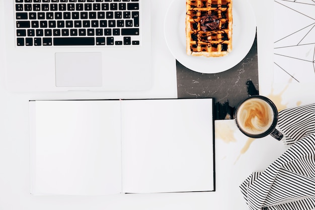 Blank White Notebook, Laptop, Waffle, Coffee Cup, and Tablecloth on White Background – Free Download