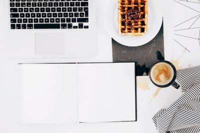 Blank White Notebook, Laptop, Waffle, Coffee Cup, and Tablecloth on White Background – Free Download