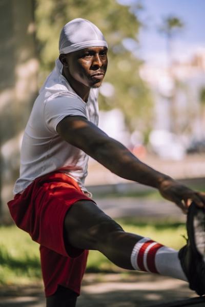 African-American Male Stretching in Park â Free Stock Photo for Download