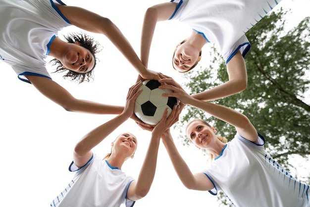 Women Holding Ball from Bottom View – Free Download