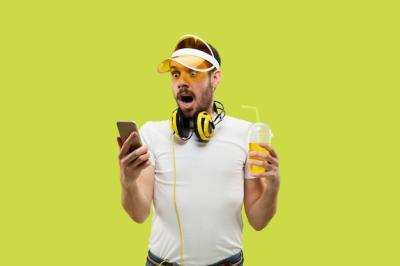 Young Man in Shirt with Headphones and Drink – Free Download