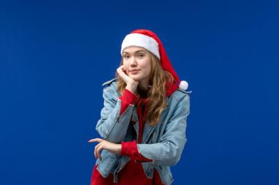 Young Female Posing on Blue Background for Christmas Holiday – Free Download