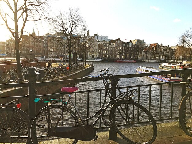 Bicycle Parked by Canal on Bridge in City – Free Stock Photo for Download