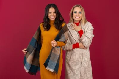 Attractive Stylish Women in Autumn Winter Fashion Posing on Red Wall – Free Stock Photo for Download