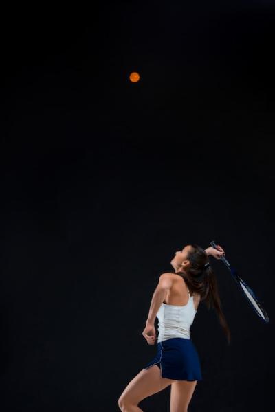 Beautiful Girl Tennis Player with Racket on Dark Background – Free Download
