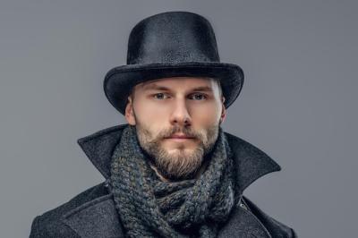 A Bearded Hipster Male in a Gray Jacket and Cylinder Hat – Free Download
