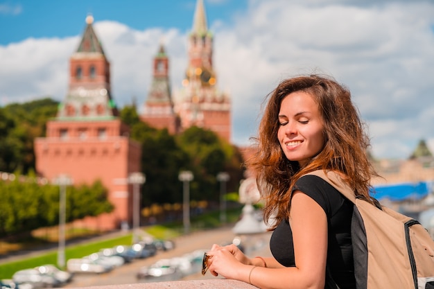 A Woman on a Bridge with the Kremlin in Moscow – Free Download