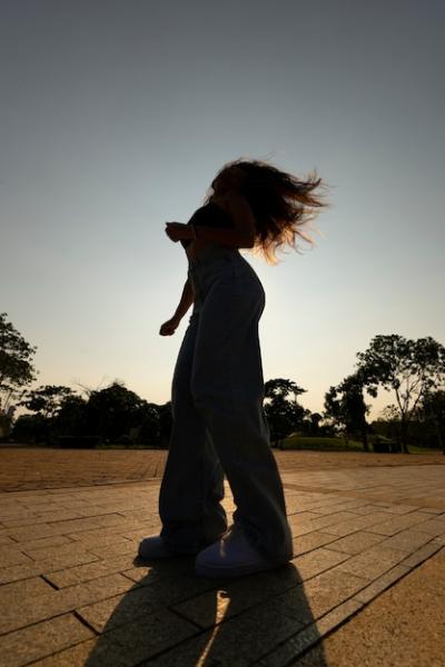 Woman Silhouette Posing at Sunset – Free Download