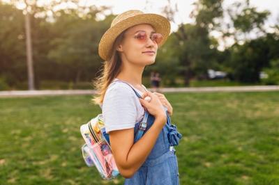 Young Woman in Straw Hat and Pink Sunglasses Enjoying a Walk in the Park – Free Download