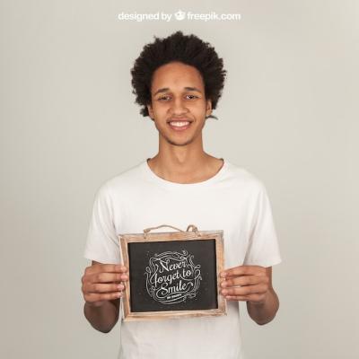 Smiling Man Presenting Slate – Free Download