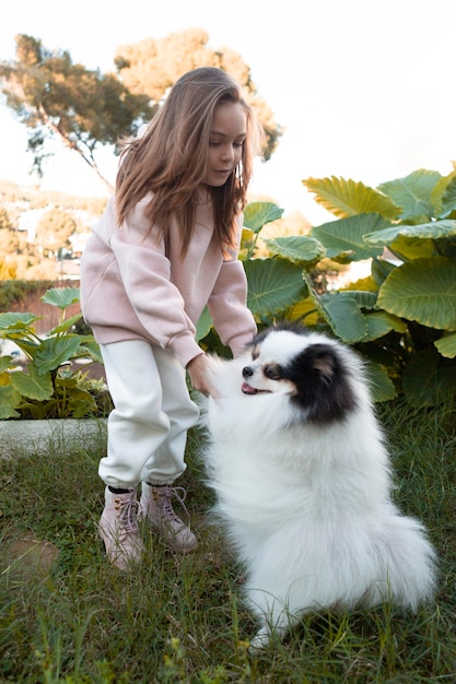 Female Child Playing with Fluffy Dog – Free Stock Photo for Download