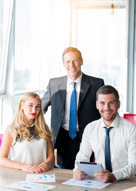 Portrait of a Boss with Colleagues in the Office – Free Download