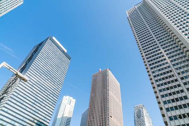 High-Rise Buildings Against a Blue Sky in Shinjuku, Tokyo – Free Download