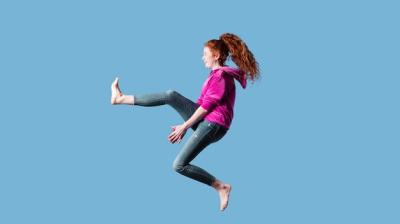 Happy Young Woman Jumping – Free Download