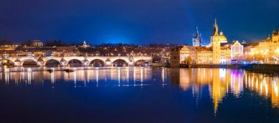 Prague’s Charles Bridge and Karlovy Lazne Illuminated at Night – Free Stock Photo for Download