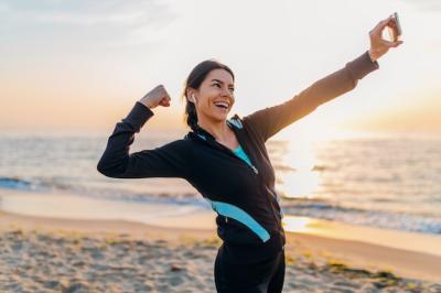 Attractive Slim Woman Exercising on the Beach at Sunrise – Free Stock Photo for Download