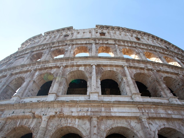 Colosseum in Rome Surrounded by a Beautiful Blue Sky – Free to Download