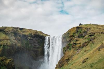 A Serene Green Hill and Waterfall Scene – Free Stock Photo for Download