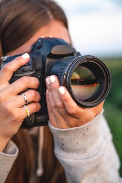 A Young Woman Portrait with a Professional Camera in Nature – Free Download