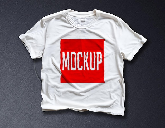 A White T-Shirt with a Red Square on a Black Surface – Free Download