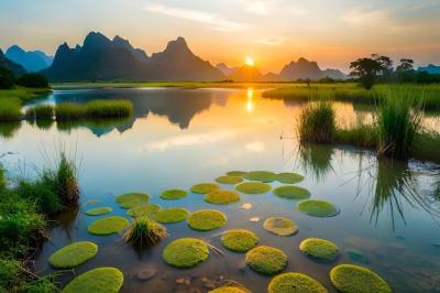A Breathtaking Sunset Over a Lake Surrounded by Mountains – Free to Download