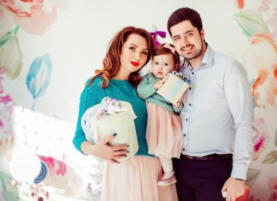 Parents Holding Their Little Daughter with Present Boxes – Free Stock Photo for Download