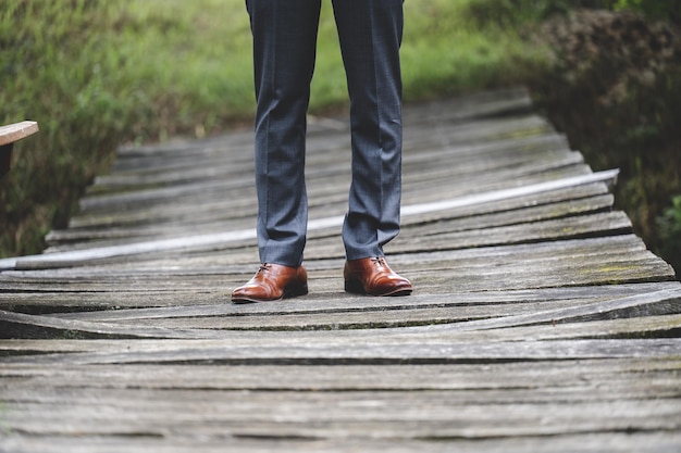 Groom’s Lower Body in Tuxedo Pants and Brown Shoes – Free Stock Photo for Download