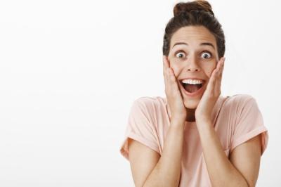 Surprised and Happy Girl Posing Against the White Wall – Free Stock Photo, Download for Free