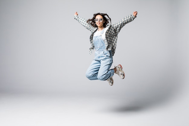 Portrait of a Laughing Woman Jumping – Free Stock Photo for Download