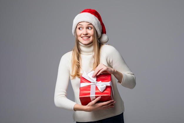 Happy Excited Young Woman in Santa Claus Hat Holding Gift Box – Free Stock Photo for Download