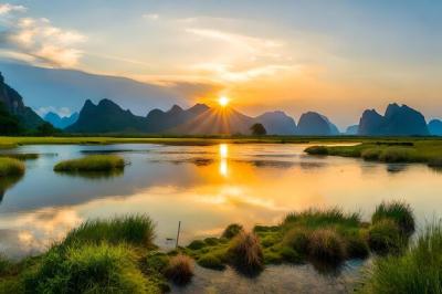 Scenic Sunset Over a Lake with Majestic Mountains – Free Download