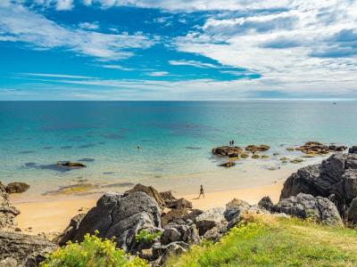 Panoramic Shot of a Rocky White Beach with Thin Clouds – Free to Download