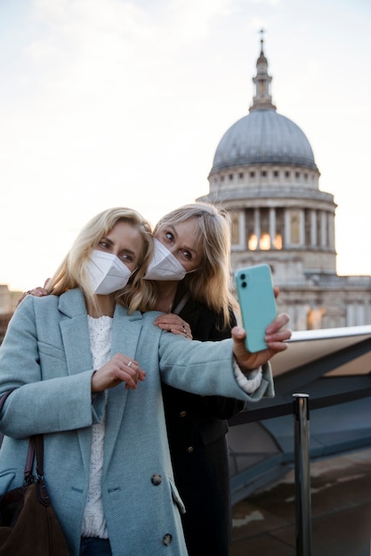 Tourists in City Wearing Travel Masks – Free Stock Photo for Download