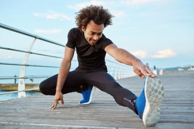 Dark-Skinned Male Athlete Stretching on Pier – Free Stock Photo, Download for Free