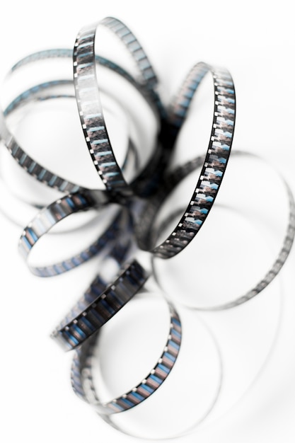 An Overhead View of Tangled Film Stripes Isolated on White Backdrop – Free Download