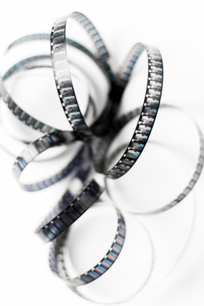 An Overhead View of Tangled Film Stripes Isolated on White Backdrop – Free Download