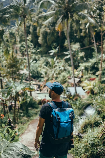 Young Guy with a Beard and Backpack in the Jungle Cap – Free Stock Photo for Download