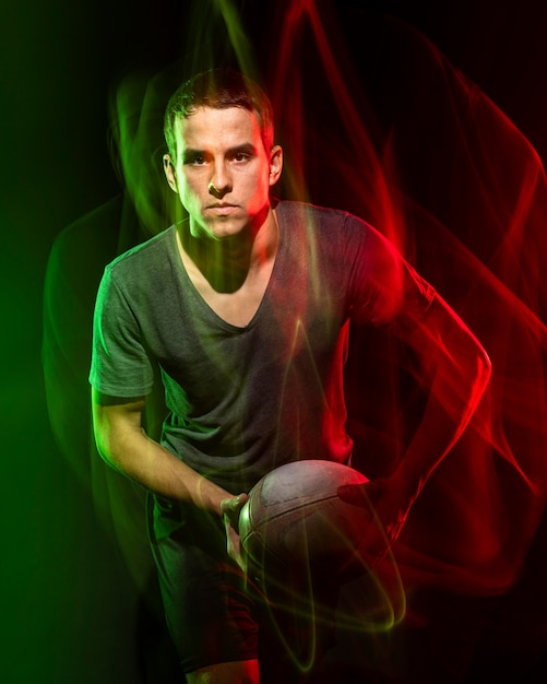 Male Rugby Player Holding Ball with Color Effect – Free Stock Photo, Download for Free
