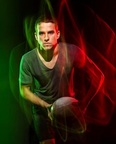 Male Rugby Player Holding Ball with Color Effect – Free Stock Photo, Download for Free
