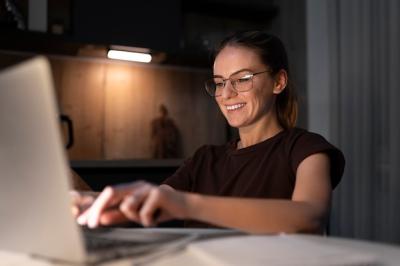 Woman Working on Laptop – Free Stock Photo for Download