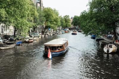 Explore Amsterdam Canals and Boating Life – Free Download