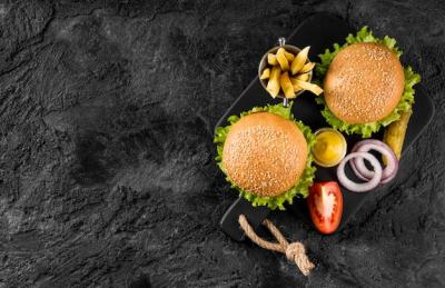 Top View of Burgers and Fries on a Cutting Board with Pickles – Free to Download