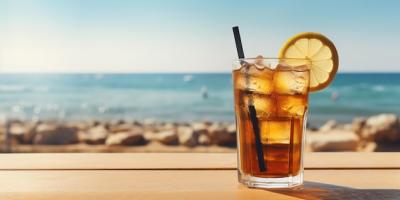 Refreshing Glass of Iced Tea with Lemon Slice by the Seaside – Free Download