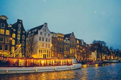 A Boat Docked in Front of a Building with a Light – Free Stock Photo for Download