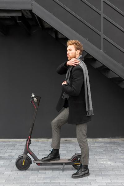 Casual Male Riding an Electric Scooter – Free Download