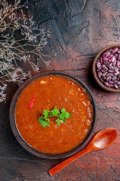 Classic Tomato Soup in a Brown Bowl on Mixed Color Table – Free Stock Photo for Download